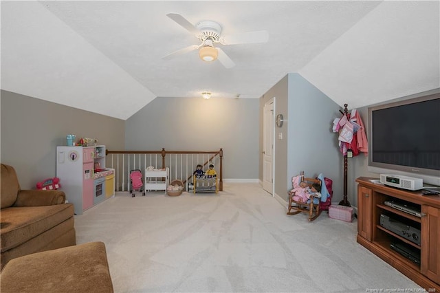 game room with carpet floors, baseboards, a ceiling fan, and vaulted ceiling