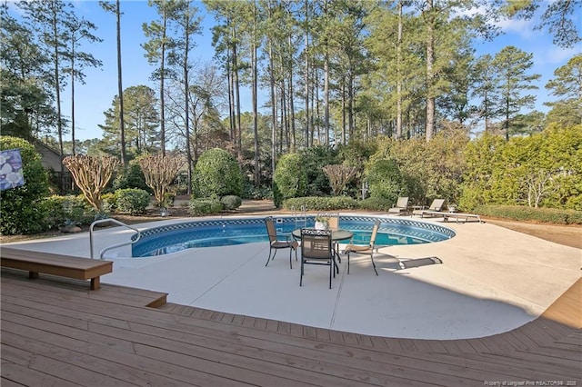 pool featuring a patio area and a wooden deck