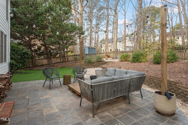 view of patio with a fenced backyard and outdoor lounge area