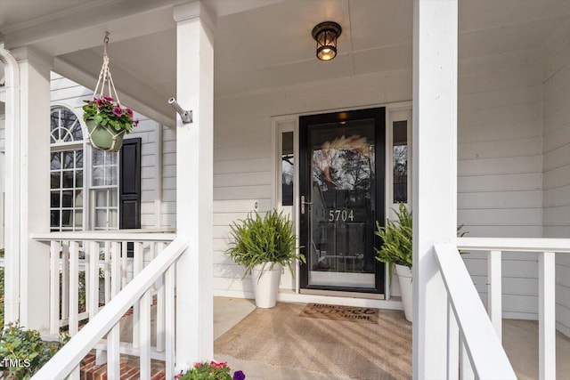 entrance to property with covered porch