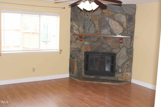 interior space with baseboards and wood finished floors