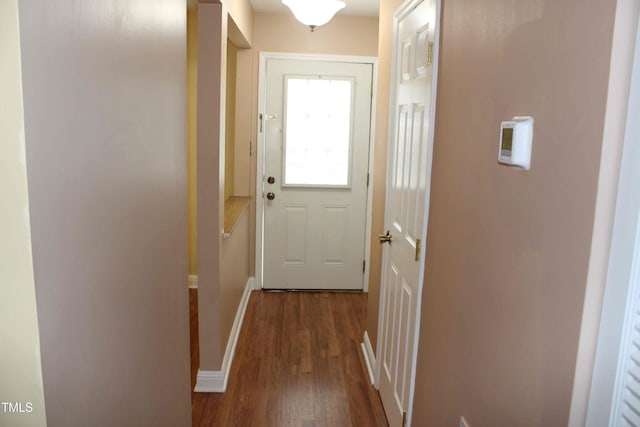 entryway with baseboards and dark wood-style flooring