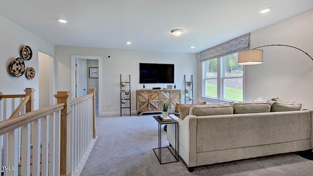 carpeted living room featuring recessed lighting and baseboards