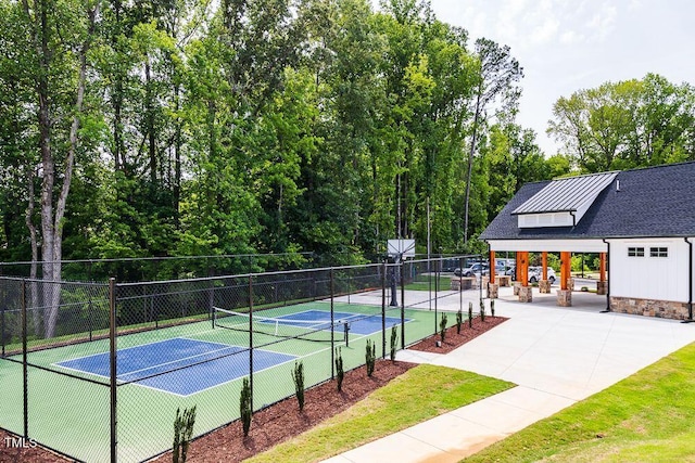 view of tennis court with fence