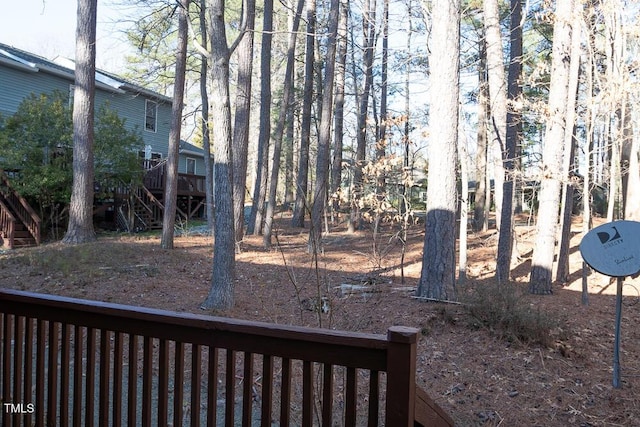 view of yard with a deck and stairway