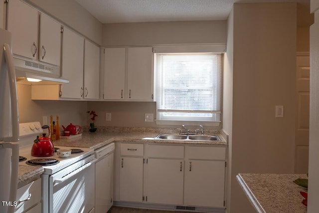 kitchen featuring white appliances, a sink, light countertops, under cabinet range hood, and white cabinetry