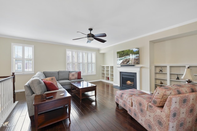 living room featuring a wealth of natural light, ornamental molding, ceiling fan, and hardwood / wood-style flooring