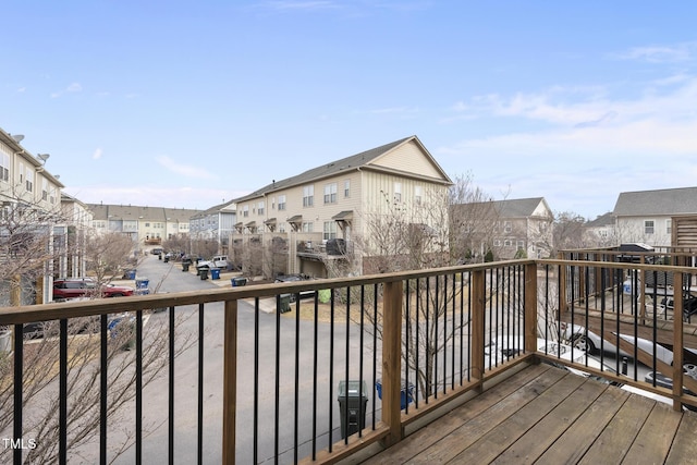 wooden terrace featuring a residential view