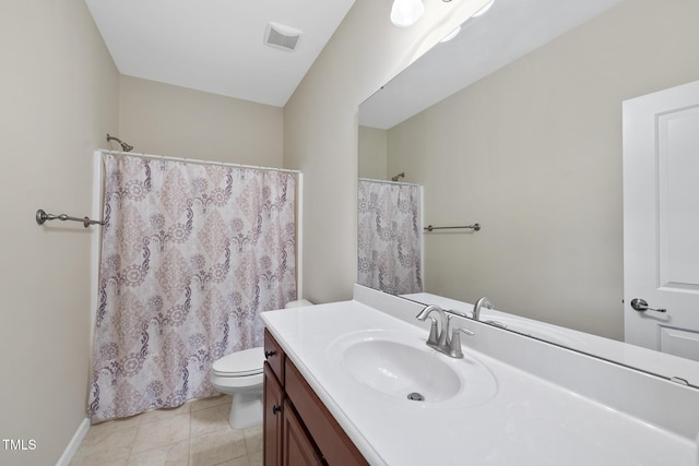 bathroom with visible vents, toilet, tile patterned flooring, baseboards, and vanity