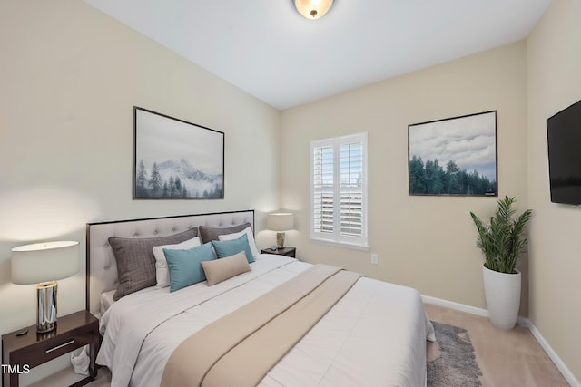 bedroom featuring baseboards and carpet floors