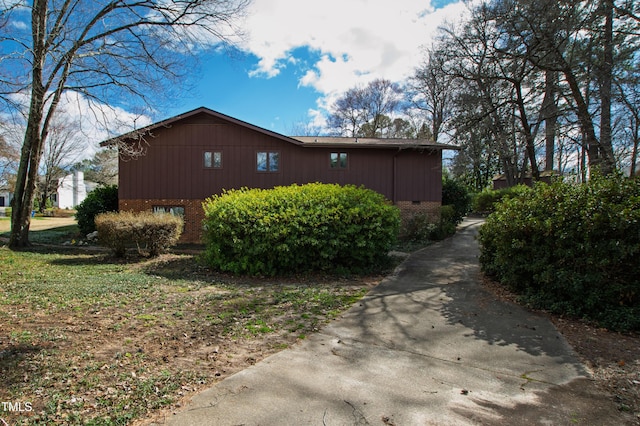 view of property exterior with brick siding