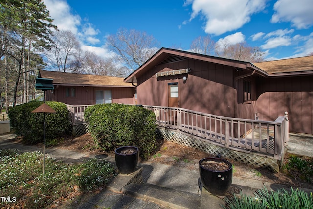 view of side of home featuring a deck