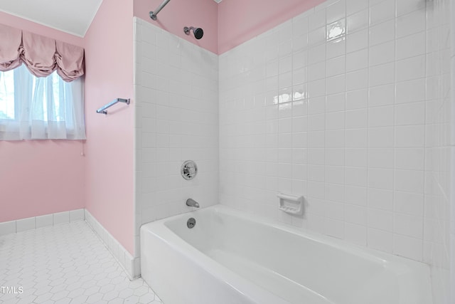 full bath featuring tile patterned flooring and baseboards