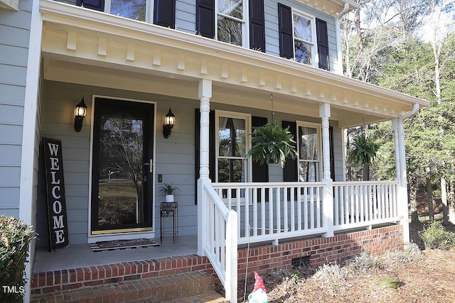 property entrance featuring covered porch