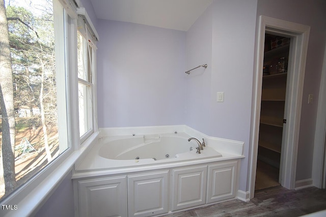 bathroom featuring a whirlpool tub