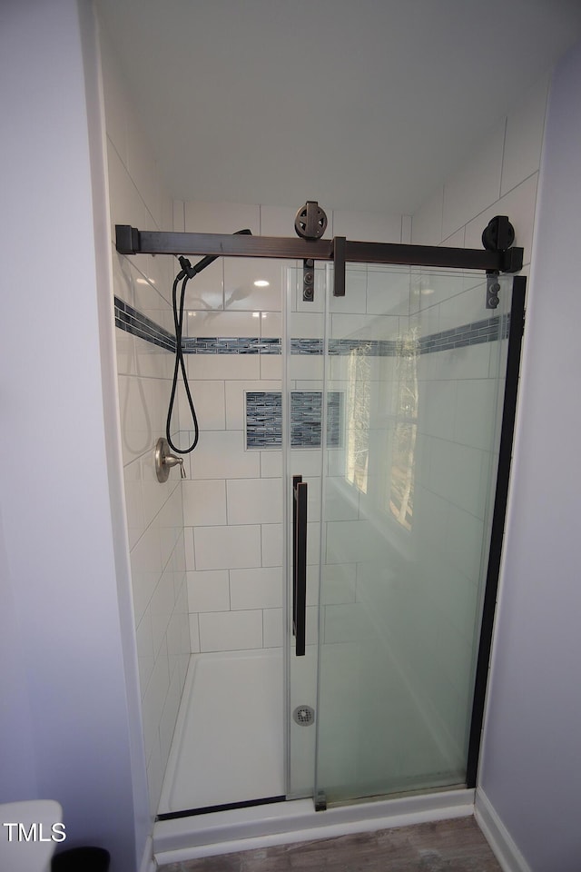 bathroom with a shower stall