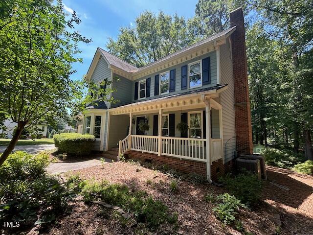 1501 Ramson Ct, Raleigh, NC 27603 - view of front of house featuring a porch and a chimney