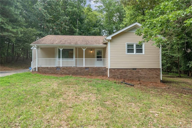 ranch-style home with crawl space, covered porch, and a front yard