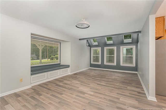 interior space with light wood-style flooring and baseboards