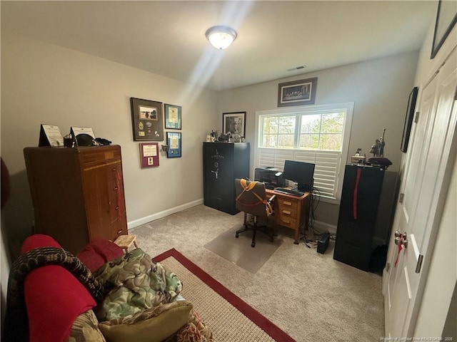 office space with visible vents, baseboards, and carpet