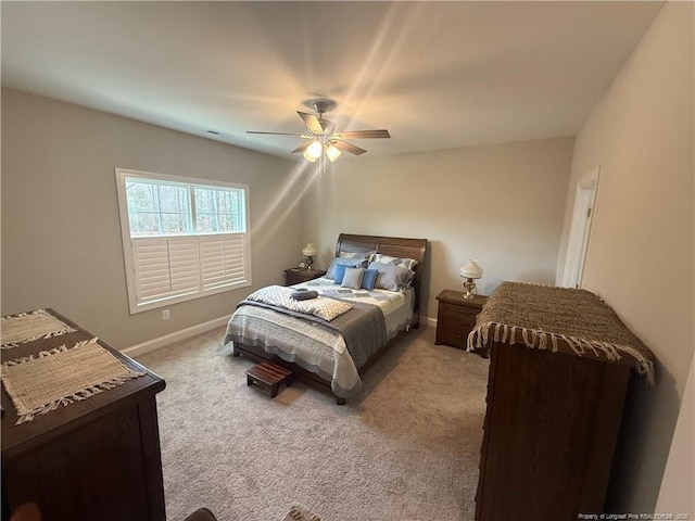 bedroom featuring ceiling fan, baseboards, and carpet floors