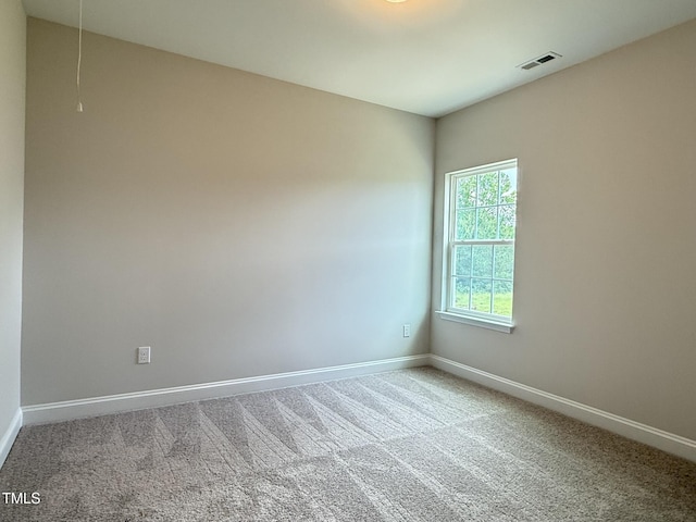1794 Parham Dr, Graham, NC 27253 - carpeted spare room featuring attic access and baseboards
