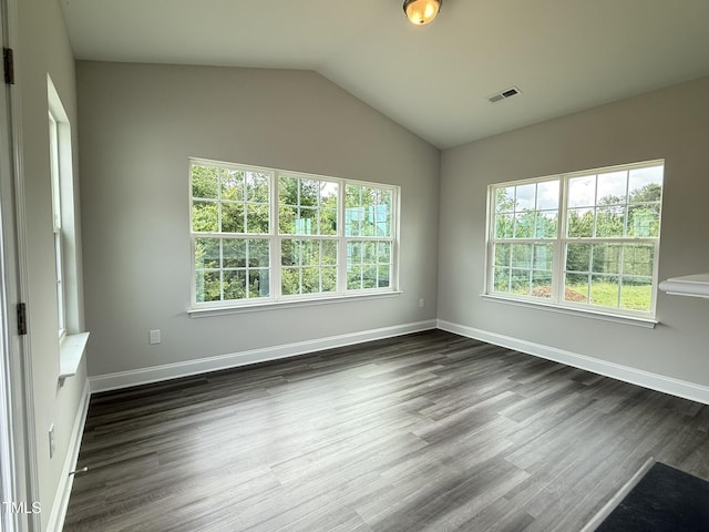 1794 Parham Dr, Graham, NC 27253 - empty room with dark wood-style flooring, baseboards, and lofted ceiling
