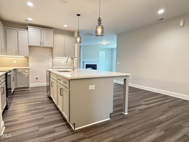 1794 Parham Dr, Graham, NC 27253 - kitchen featuring a sink, electric range oven, dark wood finished floors, a kitchen island with sink, and recessed lighting