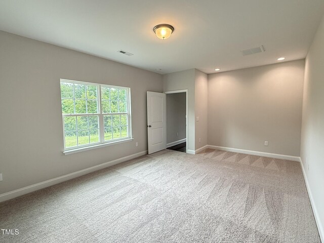 1794 Parham Dr, Graham, NC 27253 - unfurnished bedroom featuring baseboards, light colored carpet, and recessed lighting