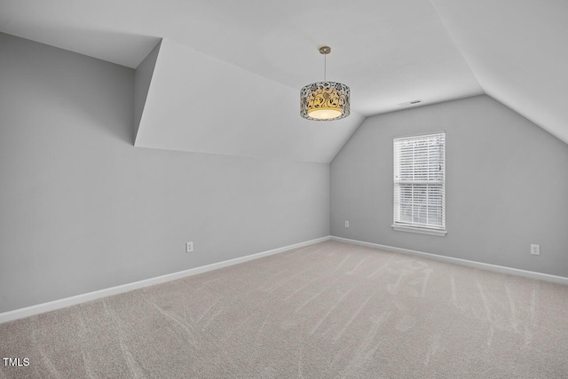 bonus room with visible vents, baseboards, and carpet