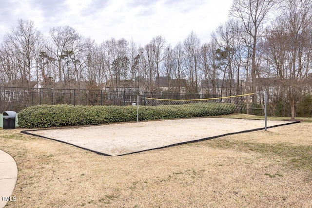 view of home's community featuring a lawn and volleyball court