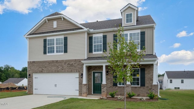 view of front of house featuring brick siding, driveway, a front lawn, and a garage