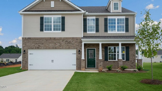 craftsman house with a garage, brick siding, board and batten siding, and a front lawn