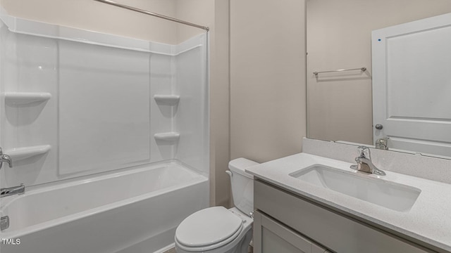 bathroom featuring vanity, toilet, and bathtub / shower combination