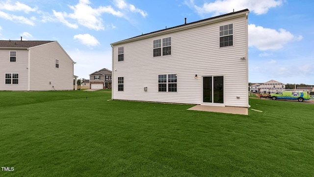 back of property with a patio and a lawn