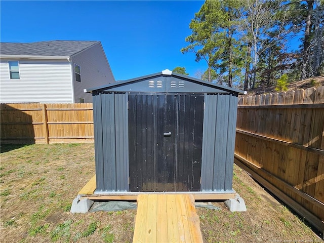 view of shed featuring a fenced backyard