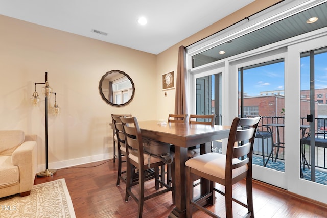 dining space featuring recessed lighting, visible vents, baseboards, and wood finished floors