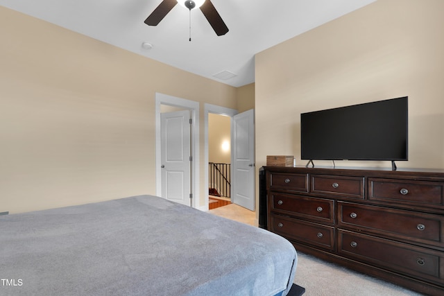 bedroom with light colored carpet and ceiling fan