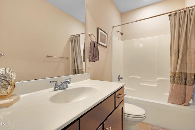 full bathroom featuring vanity, toilet, shower / bath combo with shower curtain, and tile patterned flooring