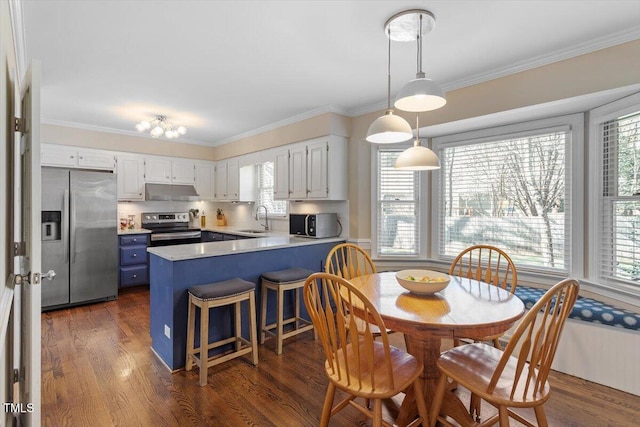 dining area featuring a wealth of natural light, dark wood-style floors, and crown molding