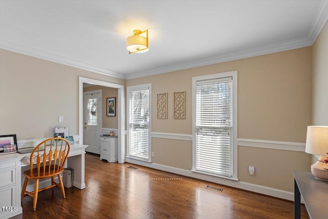 home office with visible vents, baseboards, wood finished floors, and ornamental molding