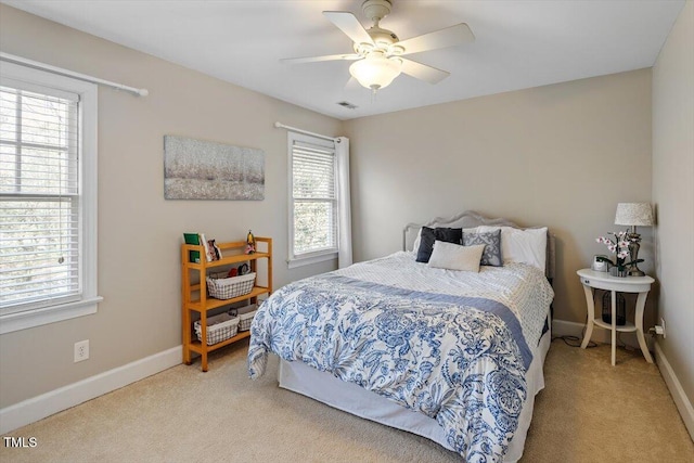 bedroom with carpet, baseboards, and ceiling fan