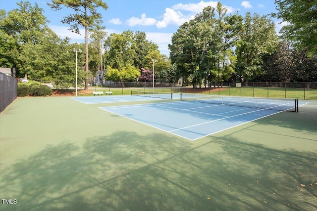 view of sport court with fence