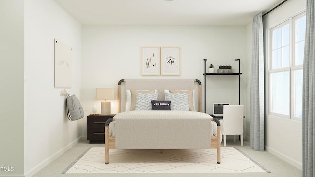 bedroom featuring light carpet and baseboards