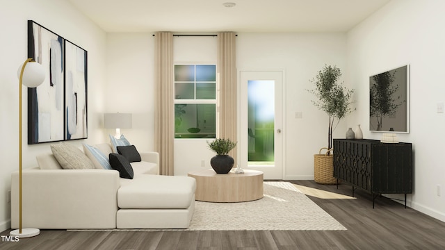 sitting room with wood finished floors and baseboards