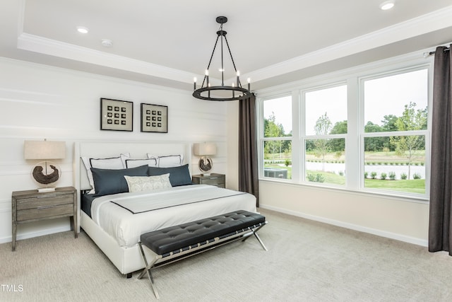 bedroom featuring baseboards, light colored carpet, a chandelier, and crown molding