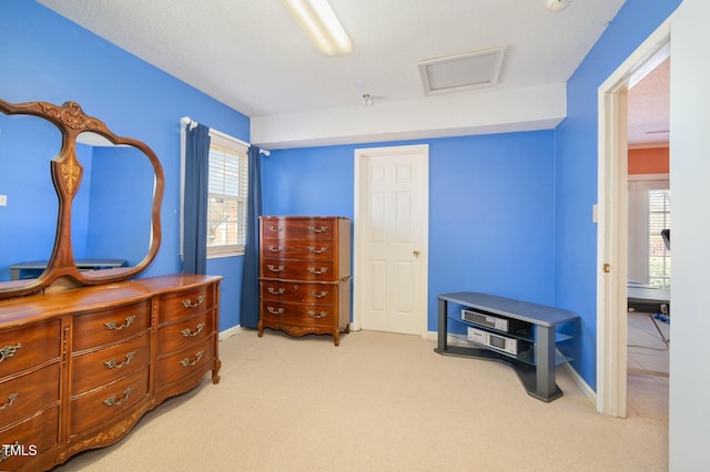 carpeted bedroom with baseboards