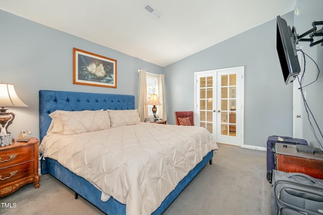 carpeted bedroom featuring visible vents, french doors, baseboards, and vaulted ceiling