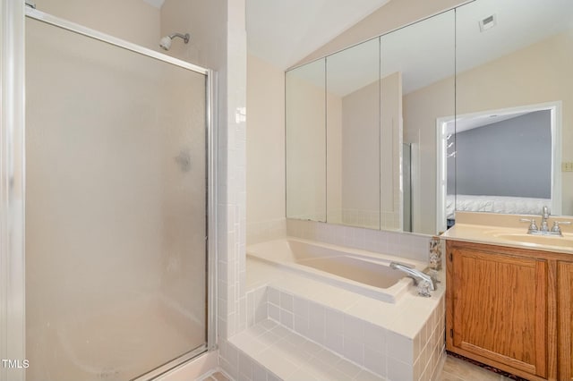 bathroom featuring visible vents, vanity, a bath, and a shower stall