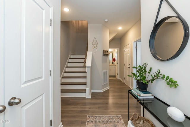 foyer entrance with visible vents, baseboards, stairs, recessed lighting, and wood finished floors